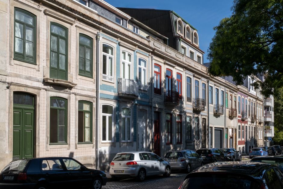 Charming colorful historical row houses in Porto, Portugal's sunny district.