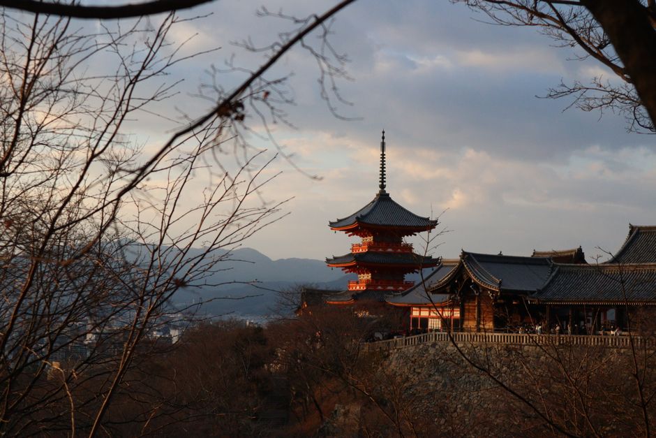 Peaceful view of a historic temple in Kyoto, Japan during sunset in autumn.