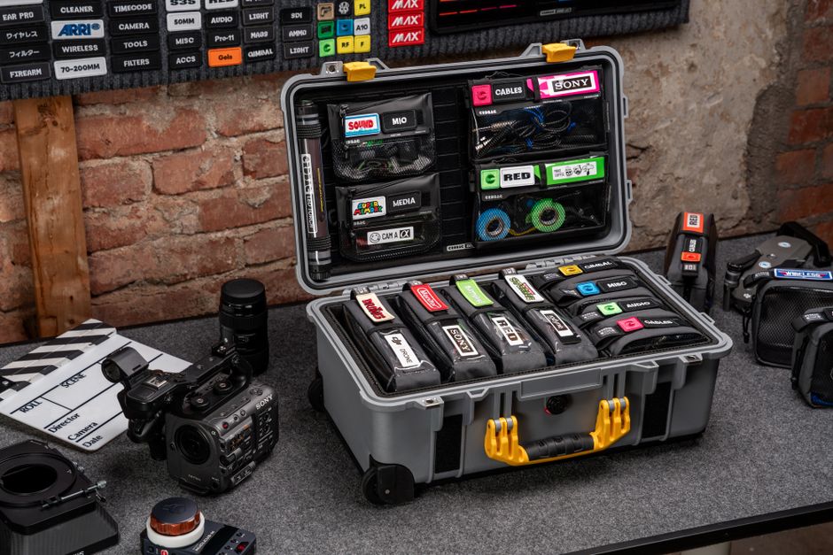 Neatly organized video production gear and camera setup on a table.